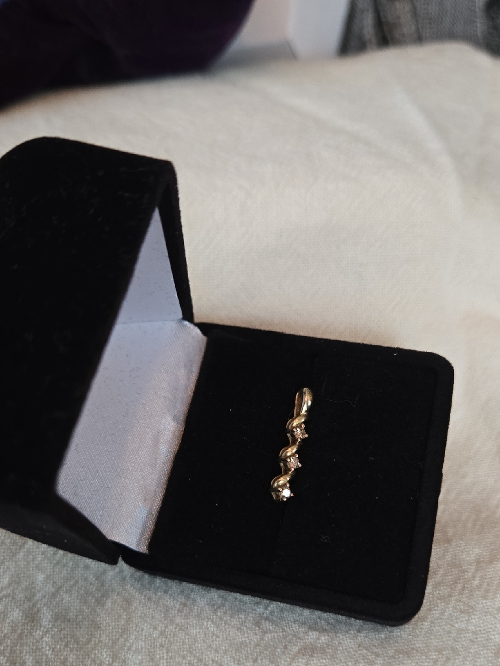Delicate, petite 10K swirly strip Pendant with three Champagne Diamonds